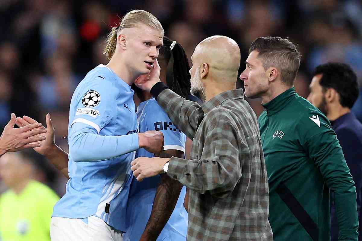 Guardiola che consola Haaland alla fine della sconitta con il Real Madrid