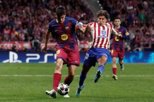 Un momento della gara tra Atletico Madrid e Barcellona di Champions League