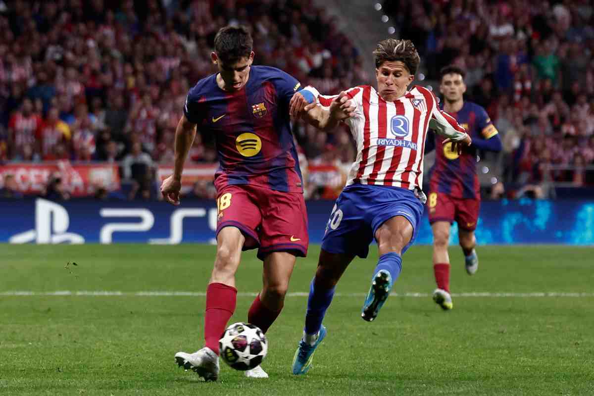 Un momento della gara tra Atletico Madrid e Barcellona di Champions League